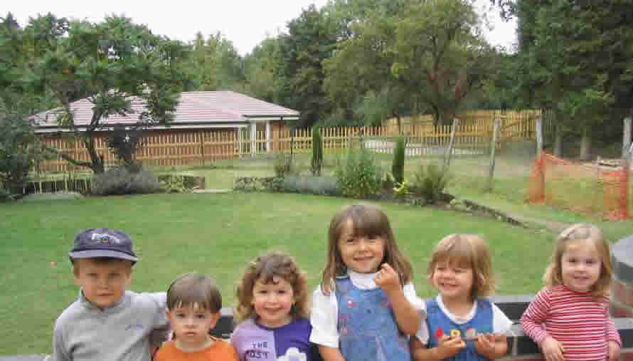 Children posing in the garden